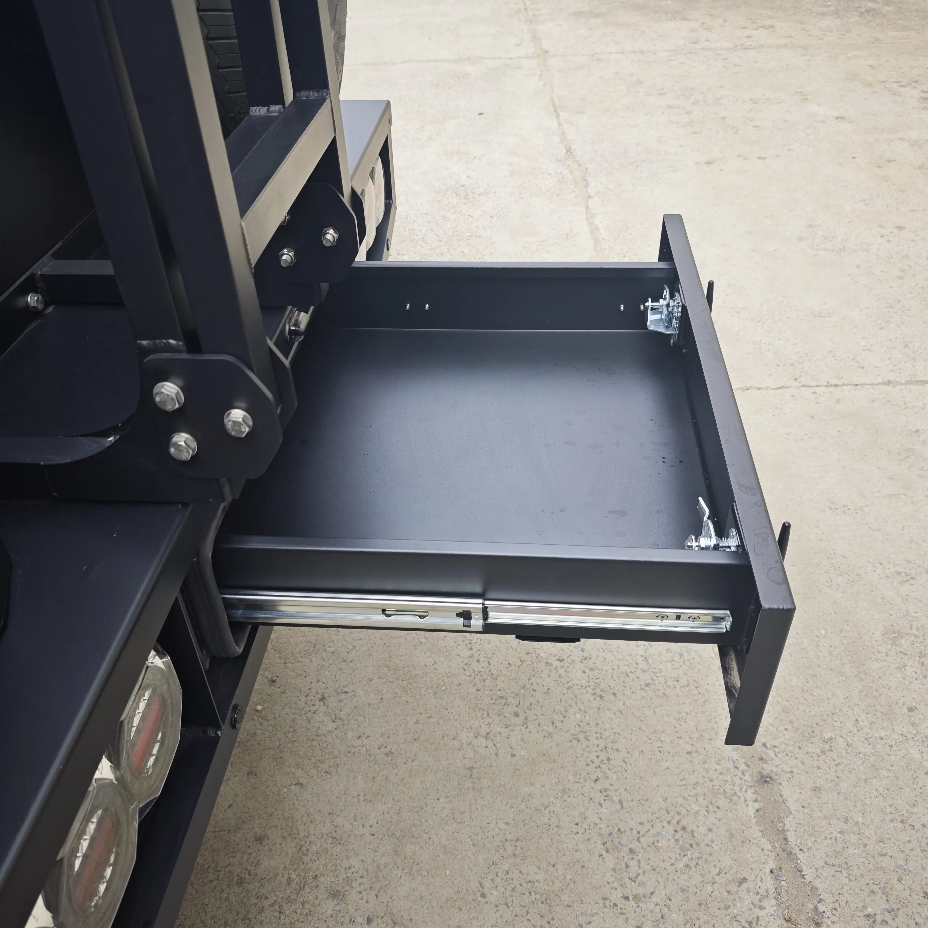 Open rear drawer storage detail inside a pickup module