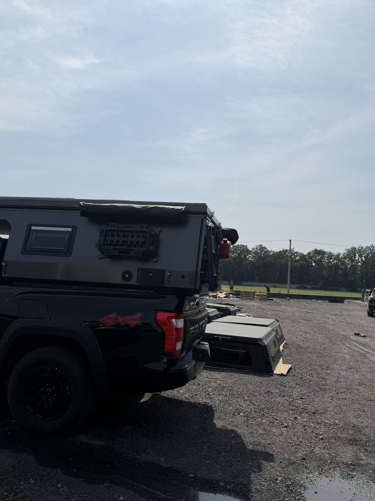 Side exterior view of a pickup bed camper module