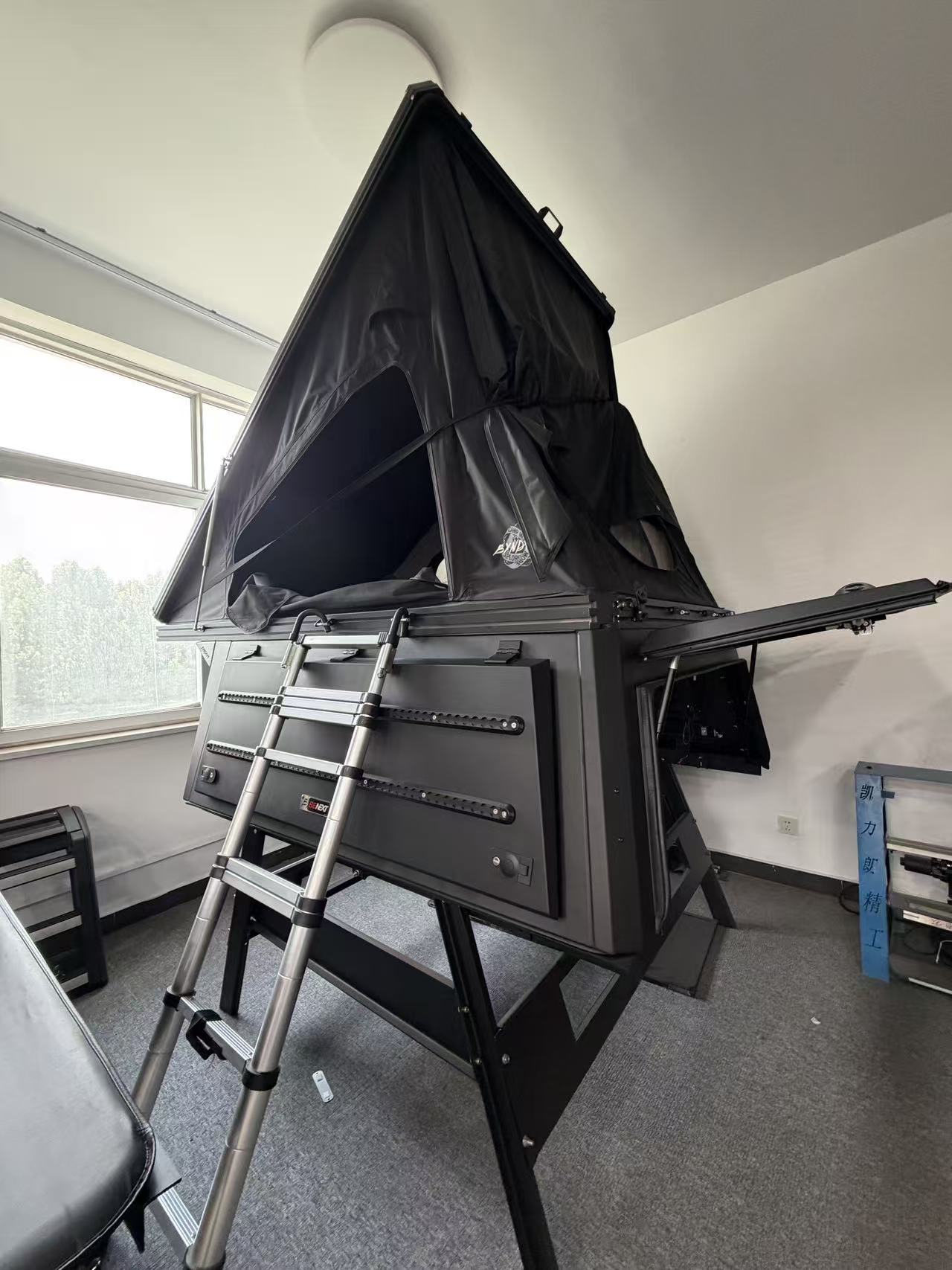 Rooftop tent module open with ladder